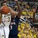 Michigan sophomore Trey Burke passes under the rim in the game against Illinois on Sunday, Feb. 24. Burke had eight assists. Daniel Brenner I AnnArbor.com